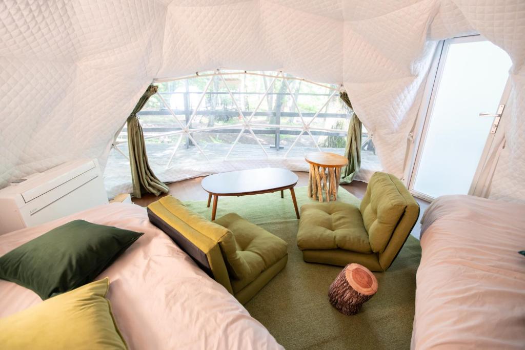 Postel nebo postele na pokoji v ubytování Nagano GLAMPINGBASE enCamp