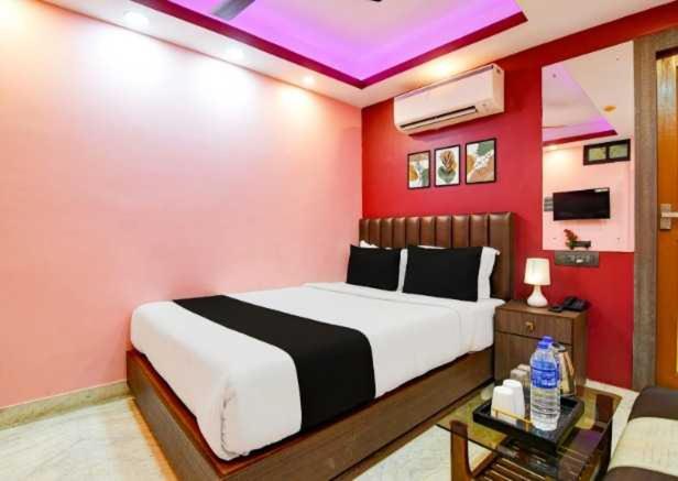 Ένα ή περισσότερα κρεβάτια σε δωμάτιο στο Super Hotel O Hamza International