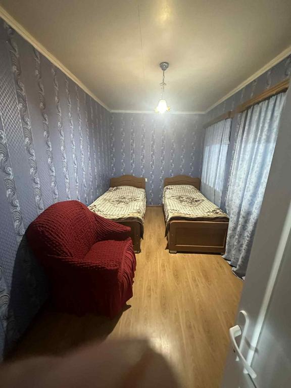 Postel nebo postele na pokoji v ubytování Guesthouse LALI GULEDANI