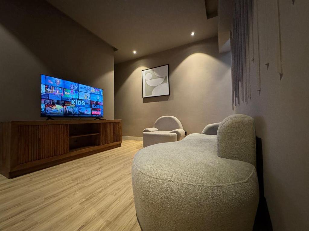 TV a/nebo společenská místnost v ubytování Penthouse