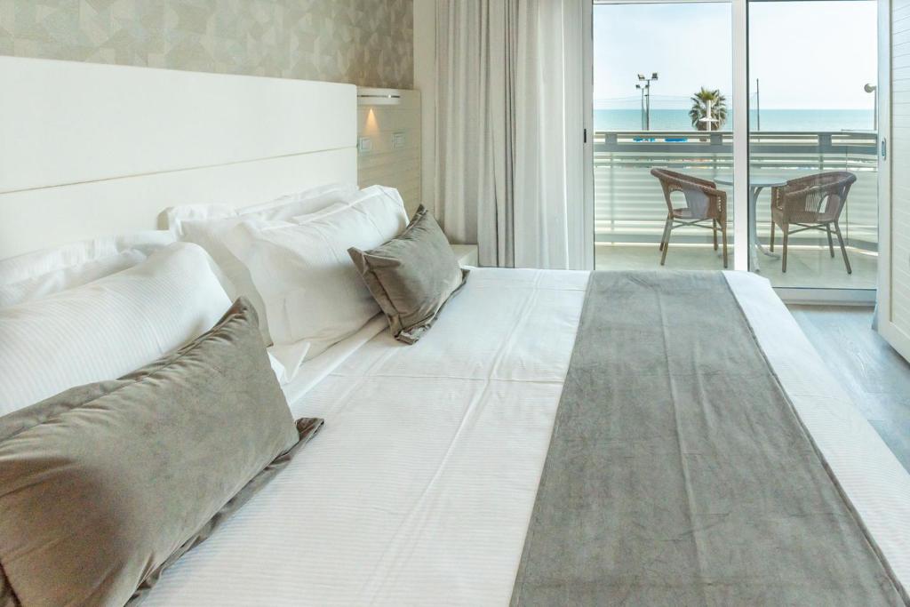 A bed or beds in a room at Club Hotel
