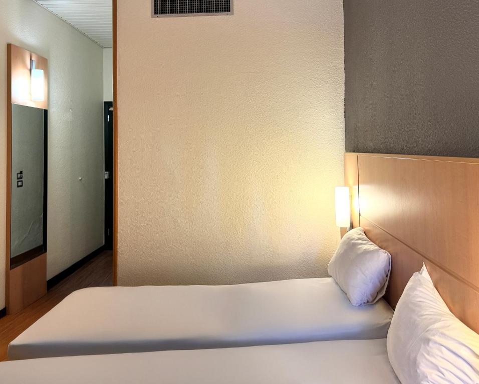 A bed or beds in a room at a&o Hostel Milano Ca Granda