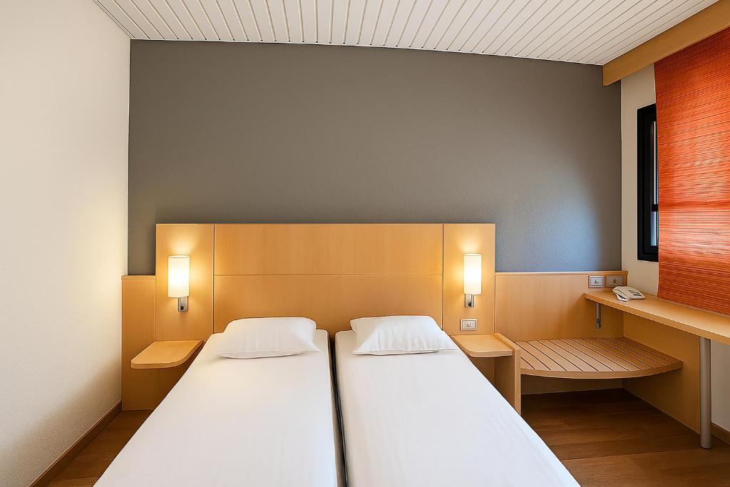 A bed or beds in a room at a&o Hostel Milano Ca Granda