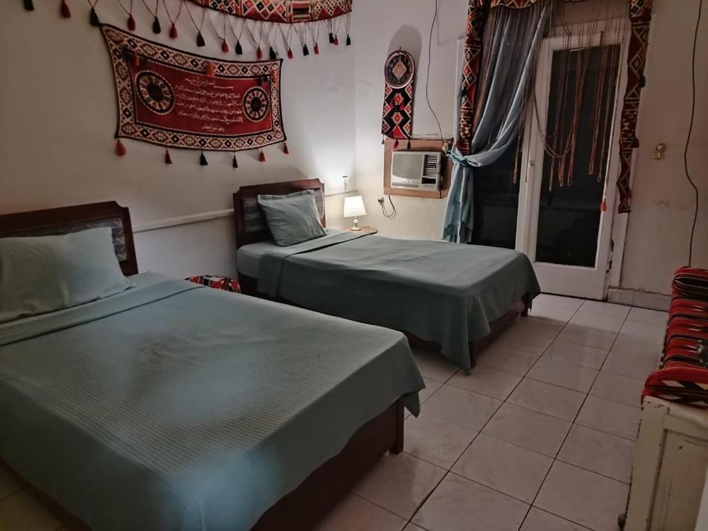 Postel nebo postele na pokoji v ubytování Downtown Cairo Hotel