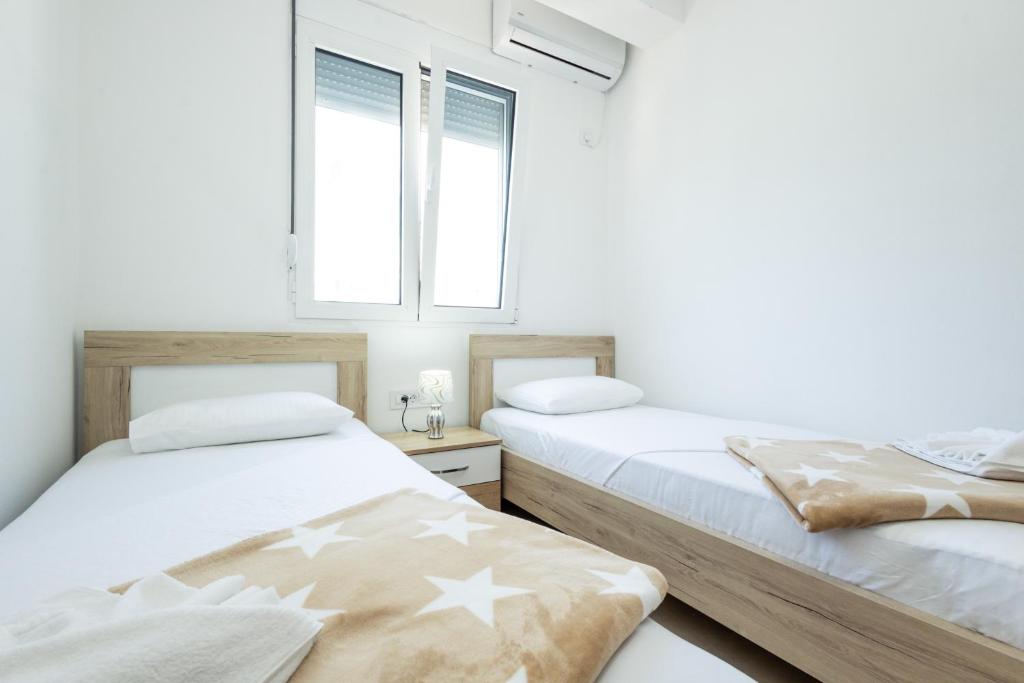 Postel nebo postele na pokoji v ubytování Dhoma Hotel