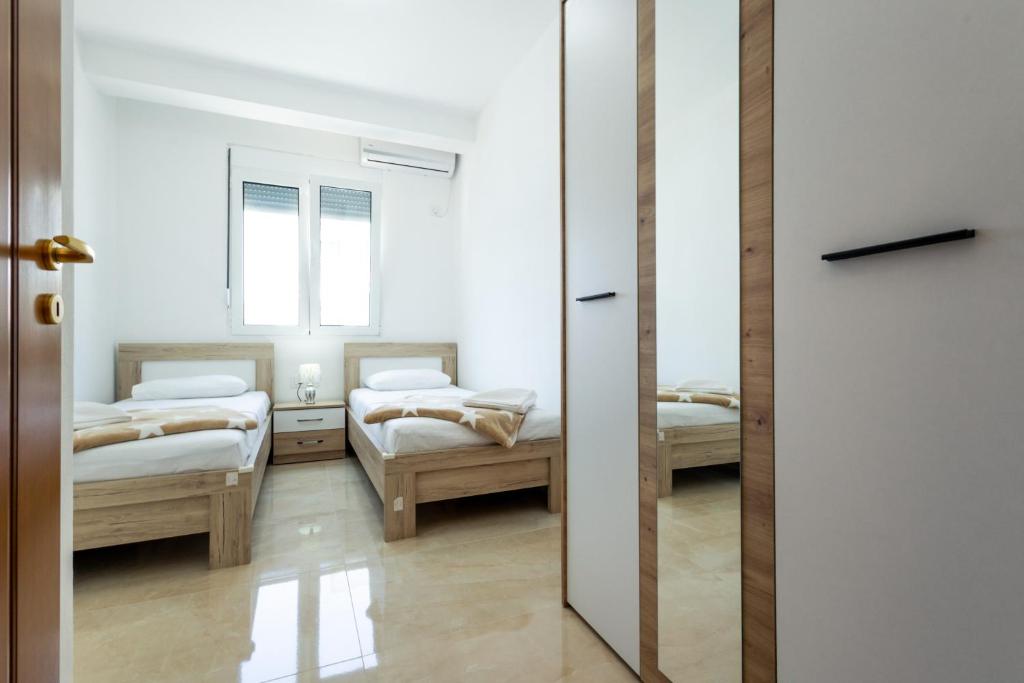 Postel nebo postele na pokoji v ubytování Dhoma Hotel