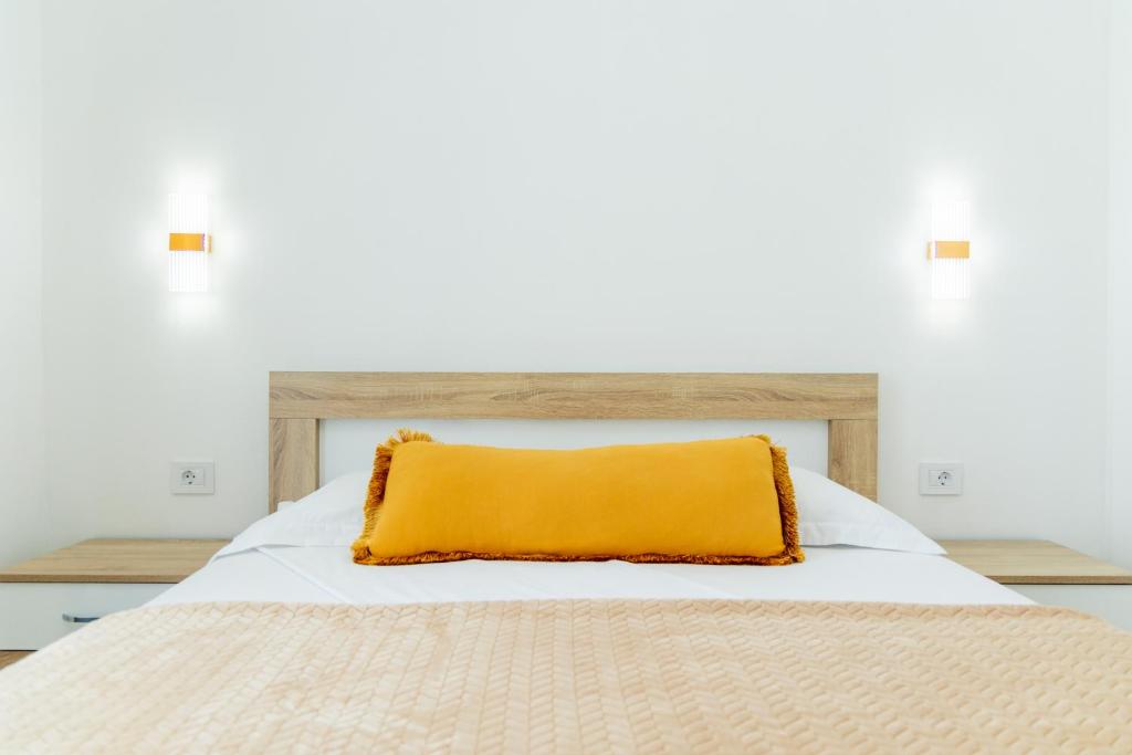 Postel nebo postele na pokoji v ubytování Dhoma Hotel