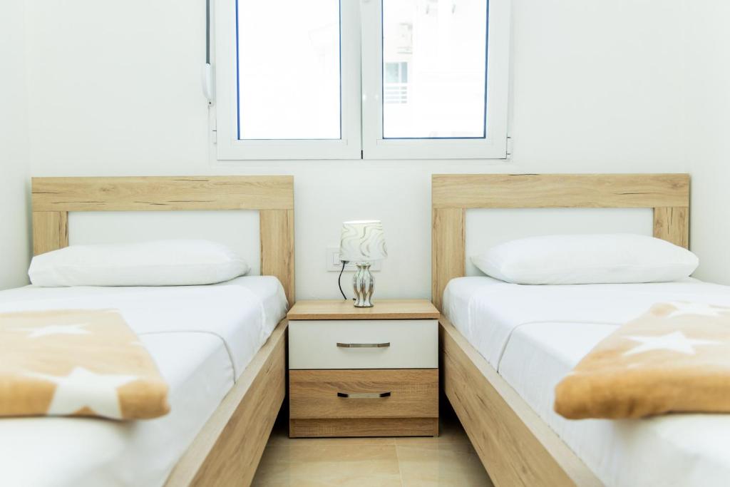 Postel nebo postele na pokoji v ubytování Dhoma Hotel
