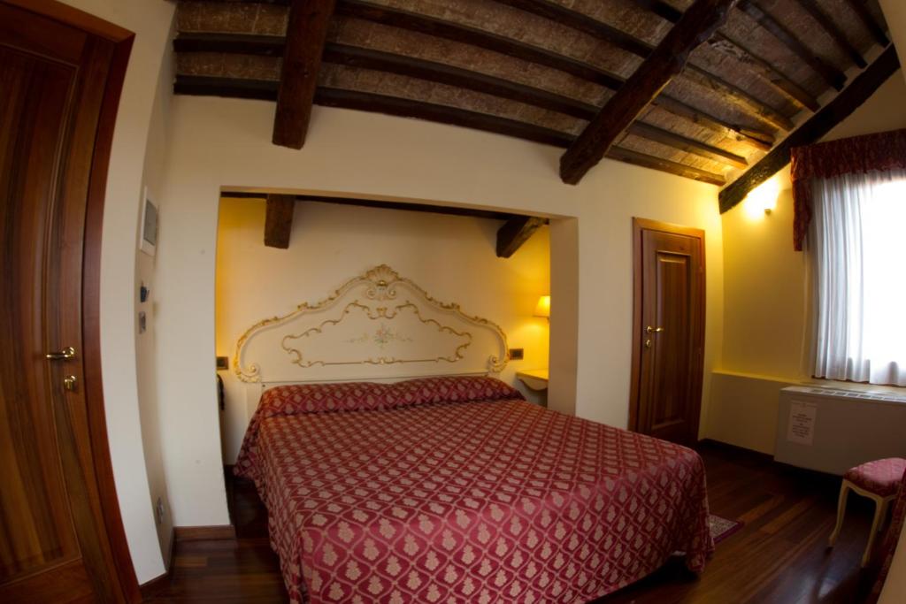 Postel nebo postele na pokoji v ubytování Locanda Poste Vecie
