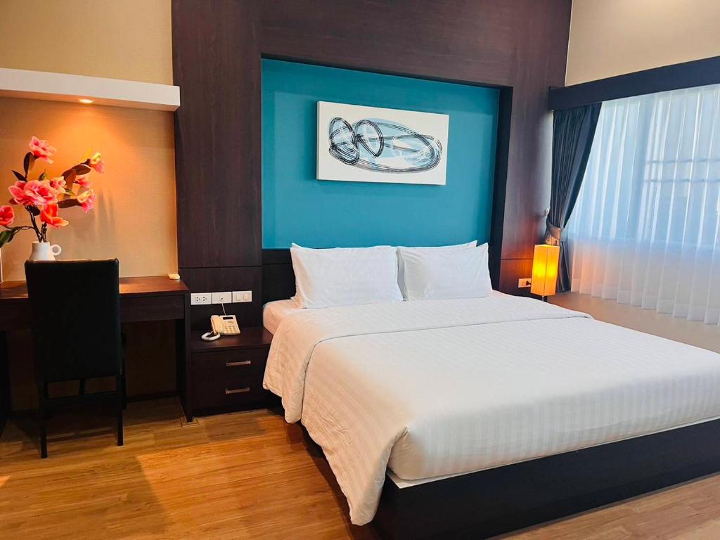 Postel nebo postele na pokoji v ubytování Eastpana Executive Residence 304 Prachinburi
