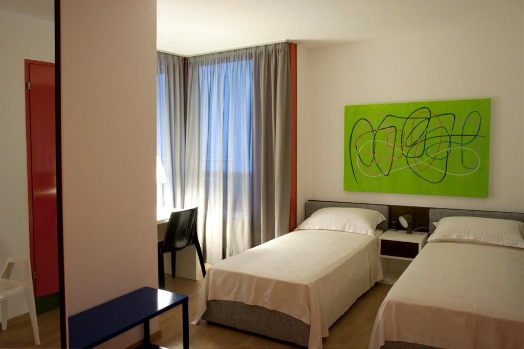 Postel nebo postele na pokoji v ubytování Hotel Garni Centro