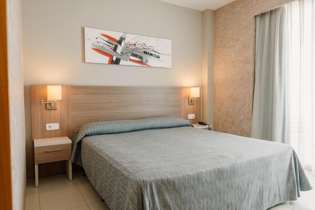 Postel nebo postele na pokoji v ubytování Hotel Lodomar Spa & Talasoterapia