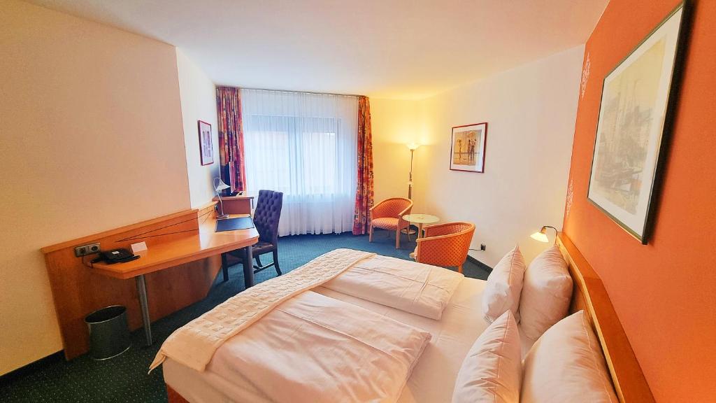 Postel nebo postele na pokoji v ubytování Hotel Panorama Hamburg-Billstedt