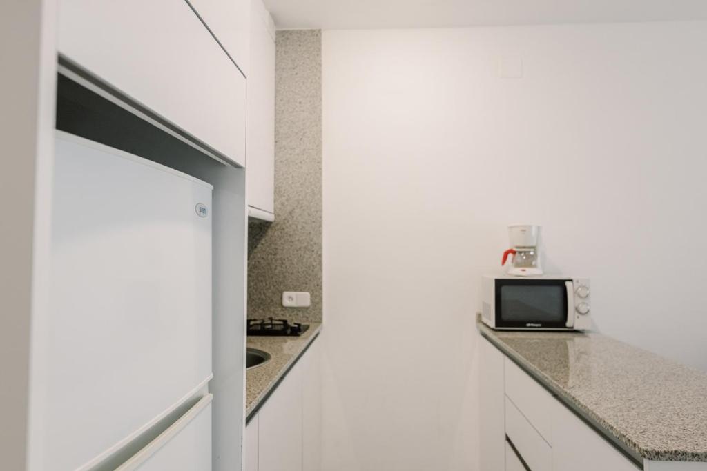 Kuchyň nebo kuchyňský kout v ubytování Hotel Lodomar Spa & Talasoterapia