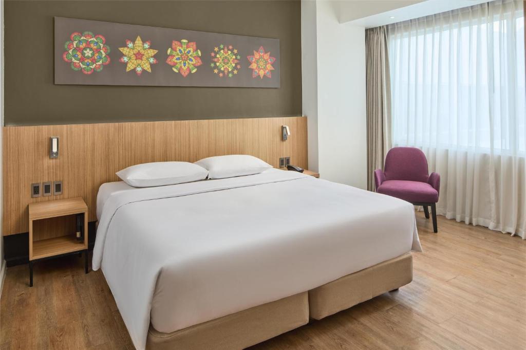 Postel nebo postele na pokoji v ubytování Park Inn By Radisson Clark