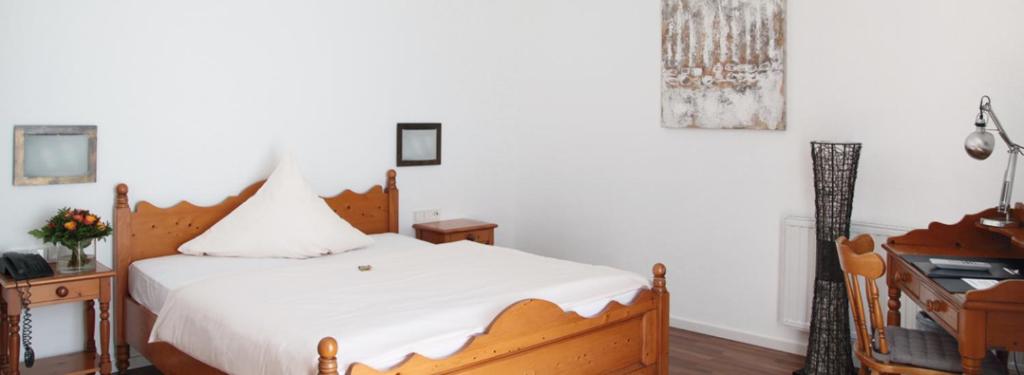 Postel nebo postele na pokoji v ubytování Hotel Goldener Stern
