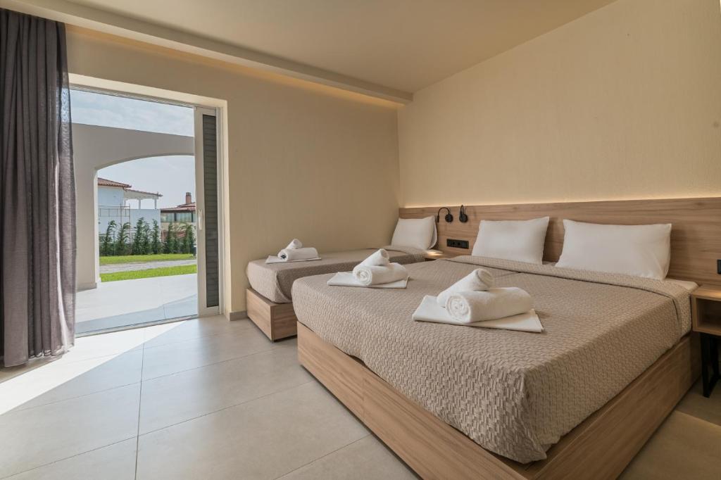 Postel nebo postele na pokoji v ubytování Arya Hotel