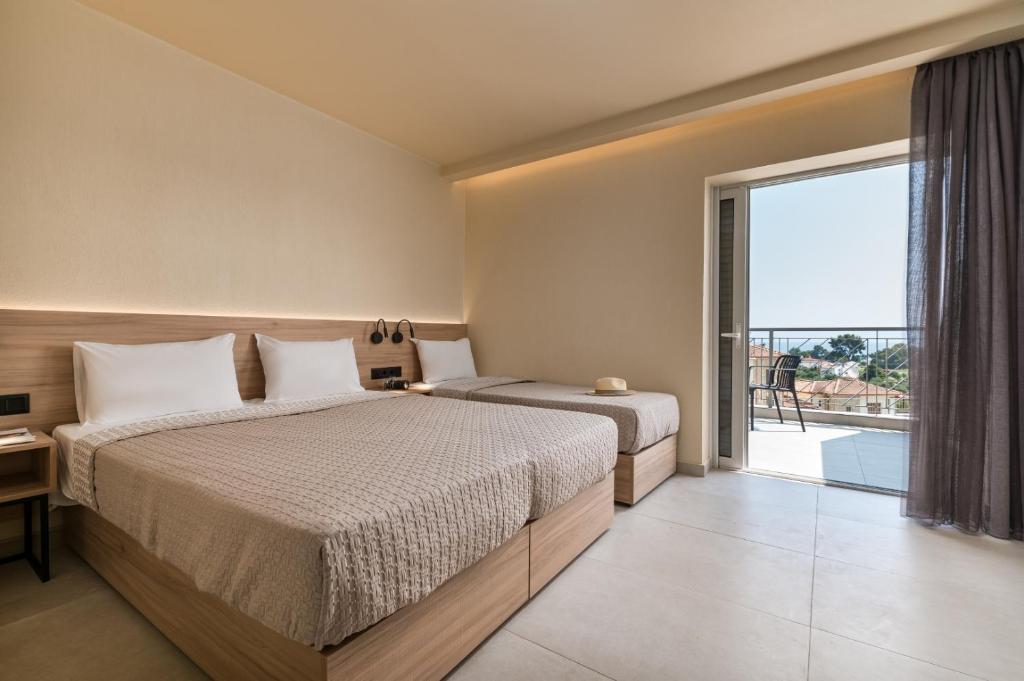 Postel nebo postele na pokoji v ubytování Arya Hotel