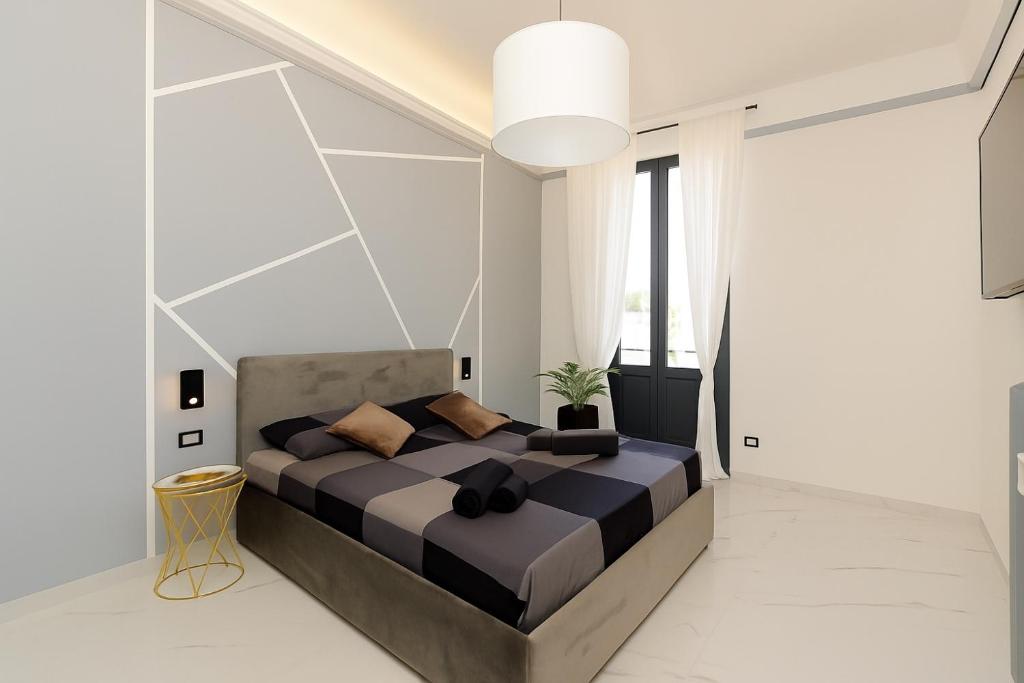 Ένα ή περισσότερα κρεβάτια σε δωμάτιο στο VivimiHome - Navigli charm design e posizione top