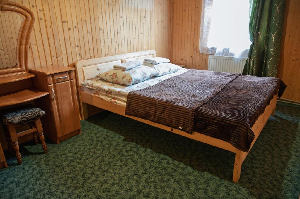 Postel nebo postele na pokoji v ubytování Котеджі "У Яни"