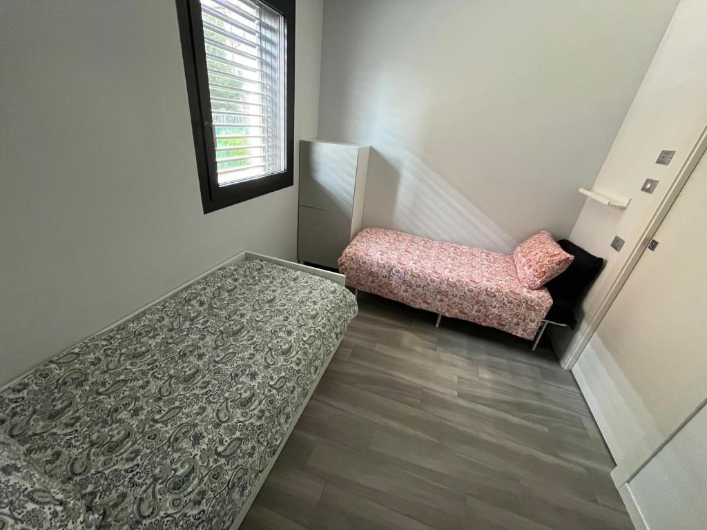 Postel nebo postele na pokoji v ubytování Casa Darcellas trilocale in a4 con giardino