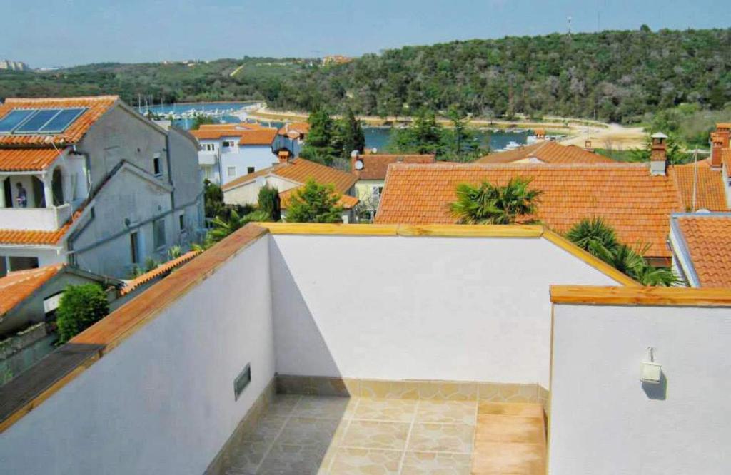 a white garage with a view of a city at Apartment Leni 2 in Banjole