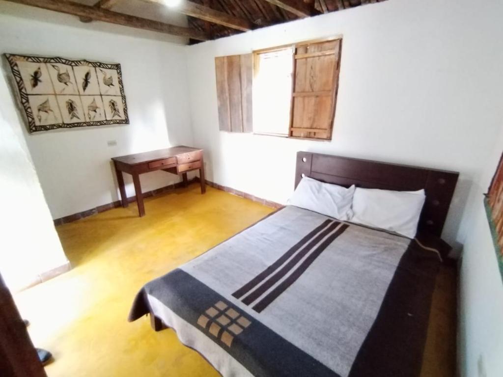 Postel nebo postele na pokoji v ubytování Casa de Rishiva