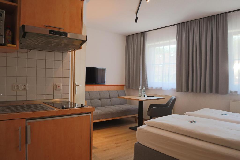 TV a/nebo společenská místnost v ubytování Mikro Apartments Erding
