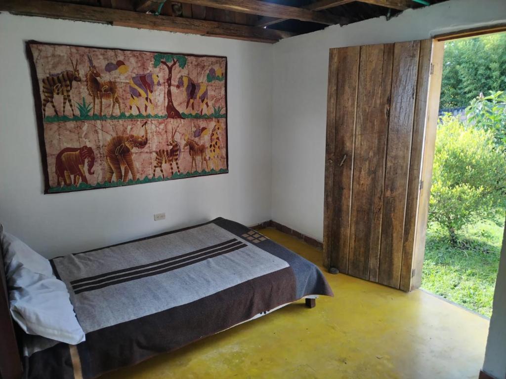 Postel nebo postele na pokoji v ubytování Casa de Rishiva