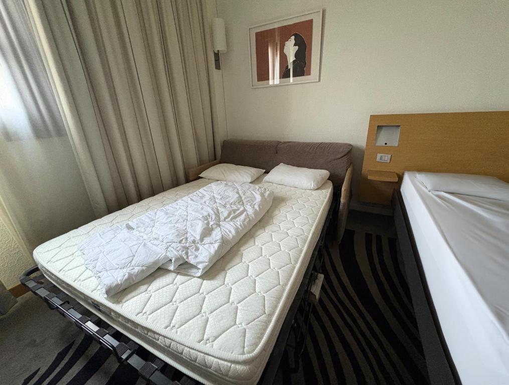 A bed or beds in a room at a&o Hostel Milano Ca Granda