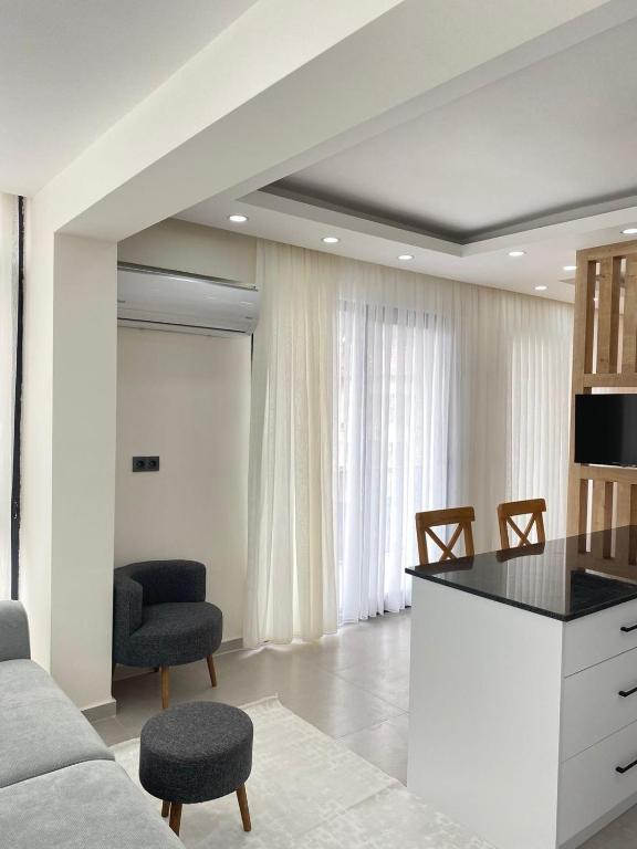 a living room with a couch and a table at Mutlu apart in the center of Fethiye in Fethiye