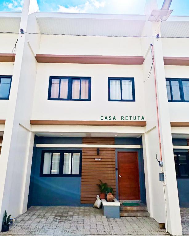 a house with a blue and white facade at Casa Retuta - Guest House for Groups in San Vincente