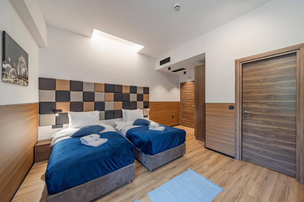 Postel nebo postele na pokoji v ubytování Hotel Garni VIZURA Sport