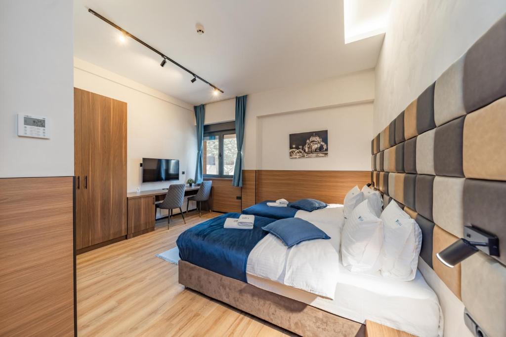 Postel nebo postele na pokoji v ubytování Hotel Garni VIZURA Sport