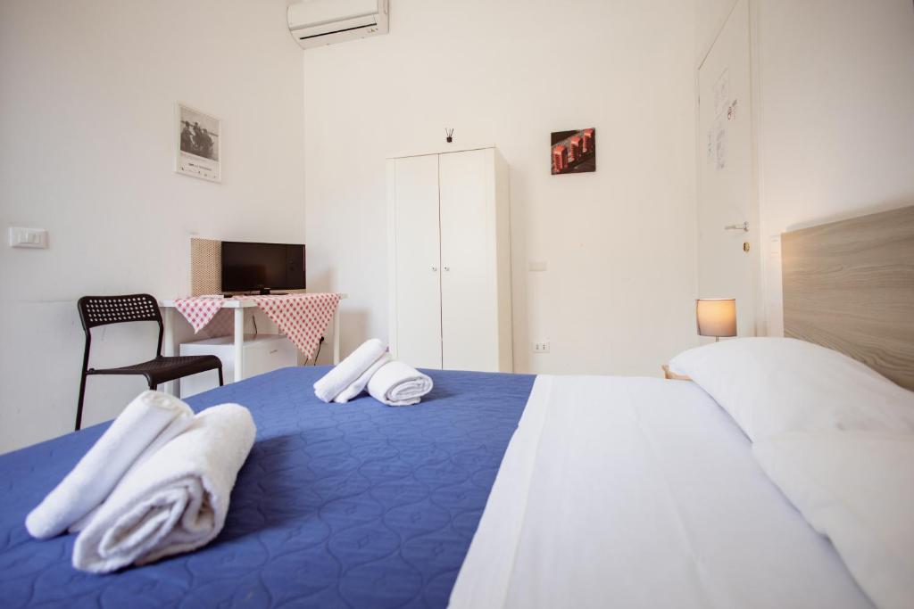 Posteľ alebo postele v izbe v ubytovaní B&B Toscana