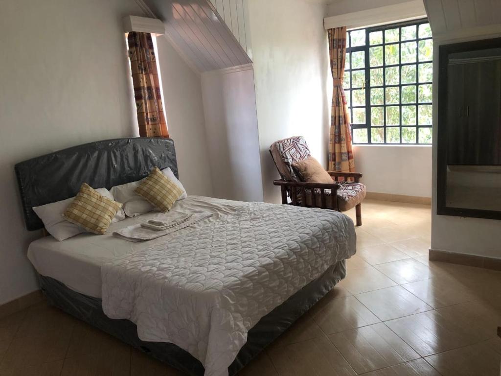 Voodi või voodid majutusasutuse Tali's Cottage toas