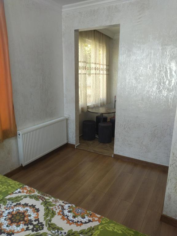 Postel nebo postele na pokoji v ubytování White House Avtandil&Nino