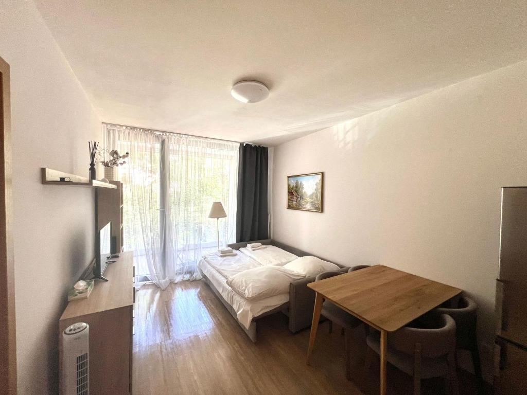 Postel nebo postele na pokoji v ubytování Kora Apartments