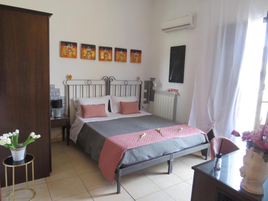Postel nebo postele na pokoji v ubytování B&B Regina Carolina