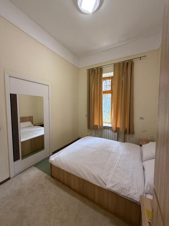 Postel nebo postele na pokoji v ubytování Green Palace