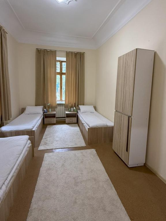 Postel nebo postele na pokoji v ubytování Green Palace