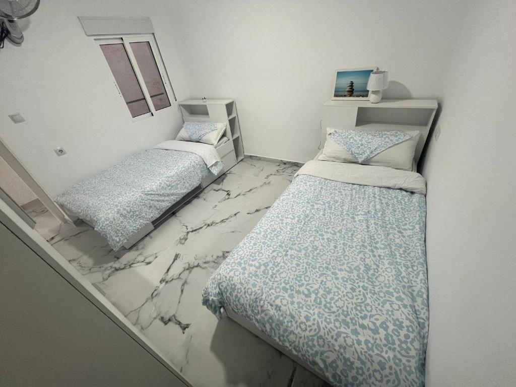Postel nebo postele na pokoji v ubytování Modern flat Mar de cristal