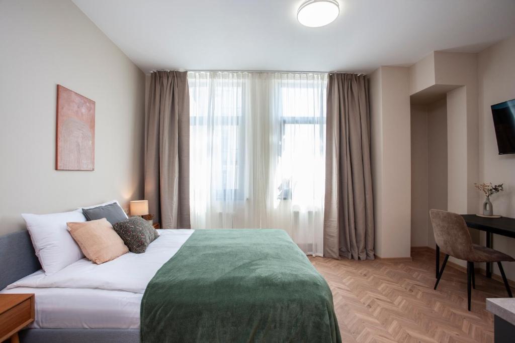 En eller flere senge i et værelse på Upisa Studio Apartments