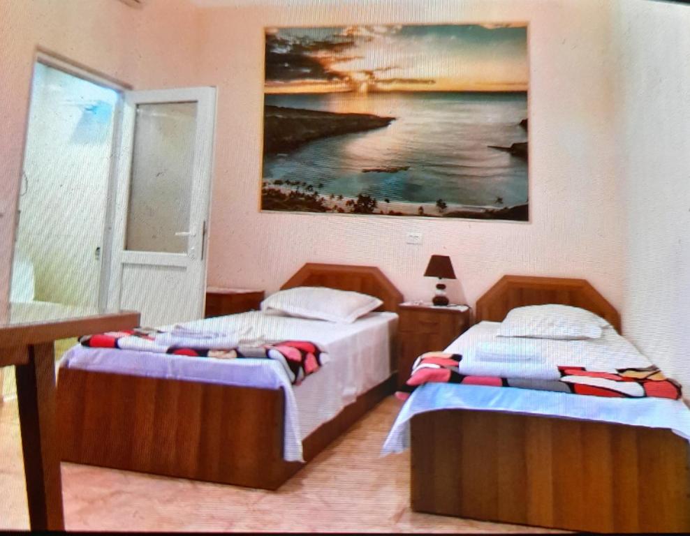 Postel nebo postele na pokoji v ubytování Gues House Aisi