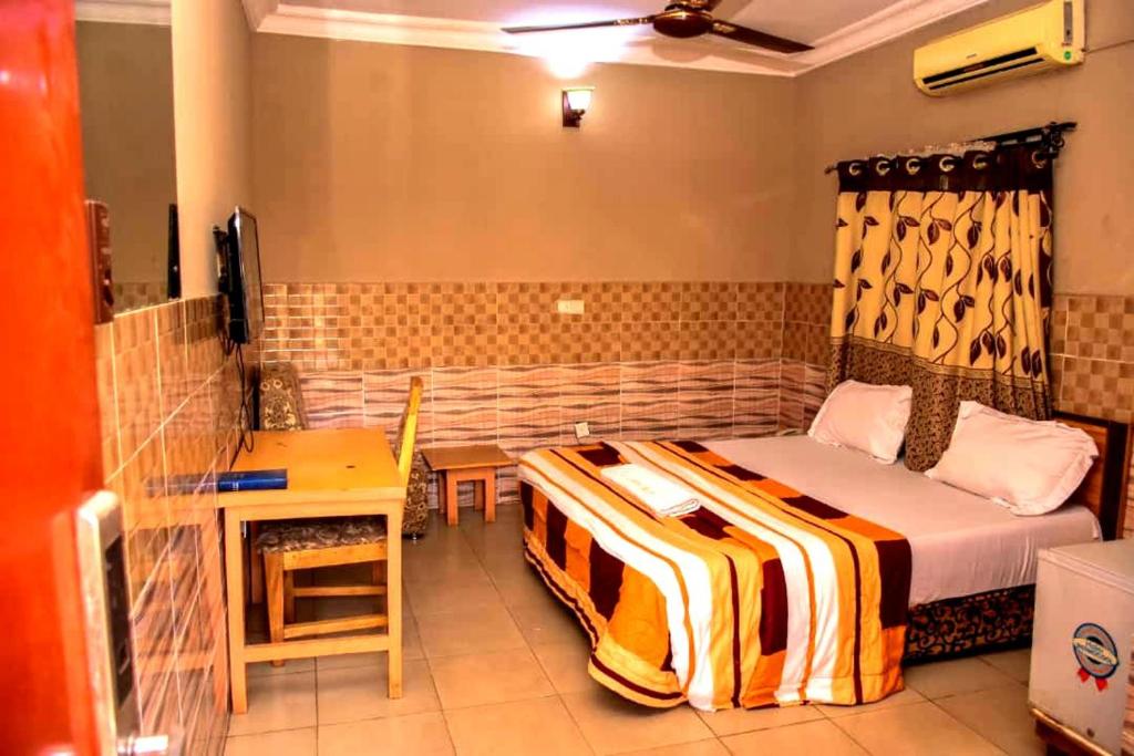 Postel nebo postele na pokoji v ubytování Abba Suites