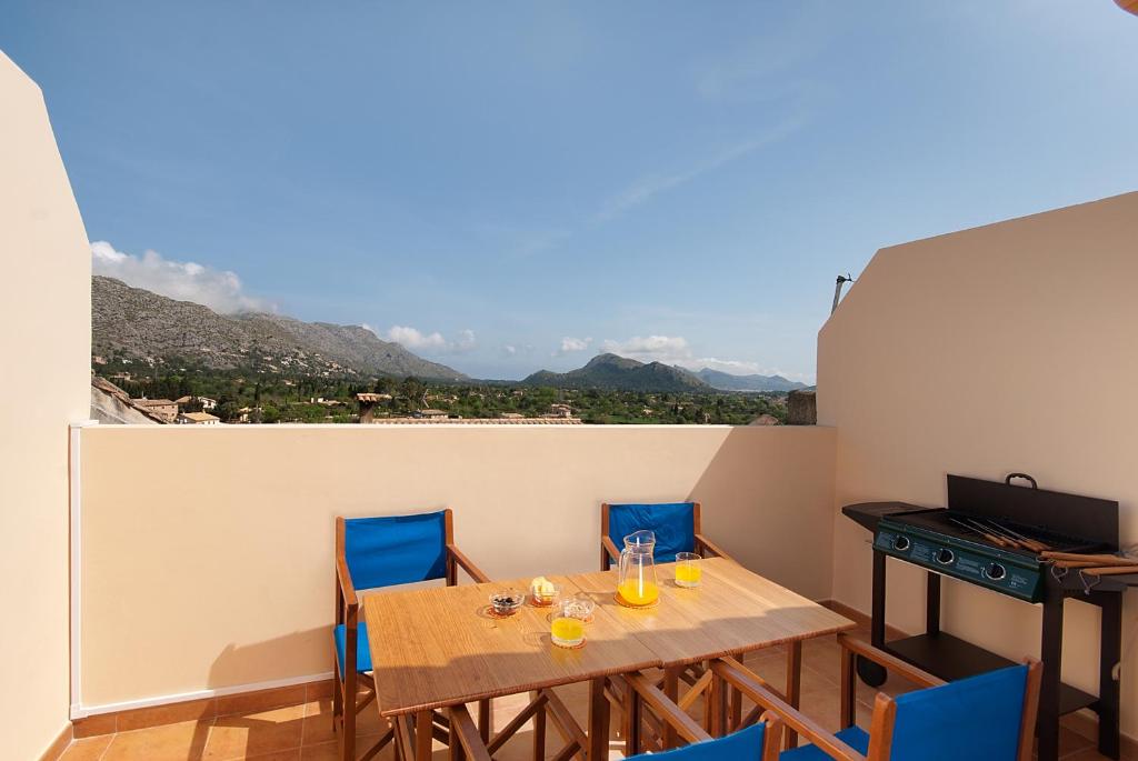 a dining room with a table and chairs with a view at Gruat 31 in Pollença