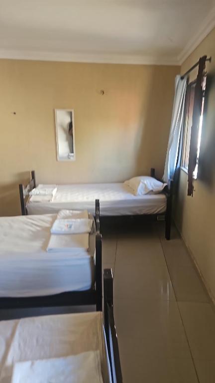 Postel nebo postele na pokoji v ubytování Good Hostel & Pousada