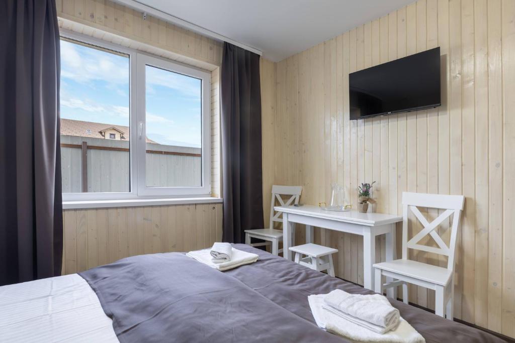 Postel nebo postele na pokoji v ubytování VASOK Hotel NEW 2025