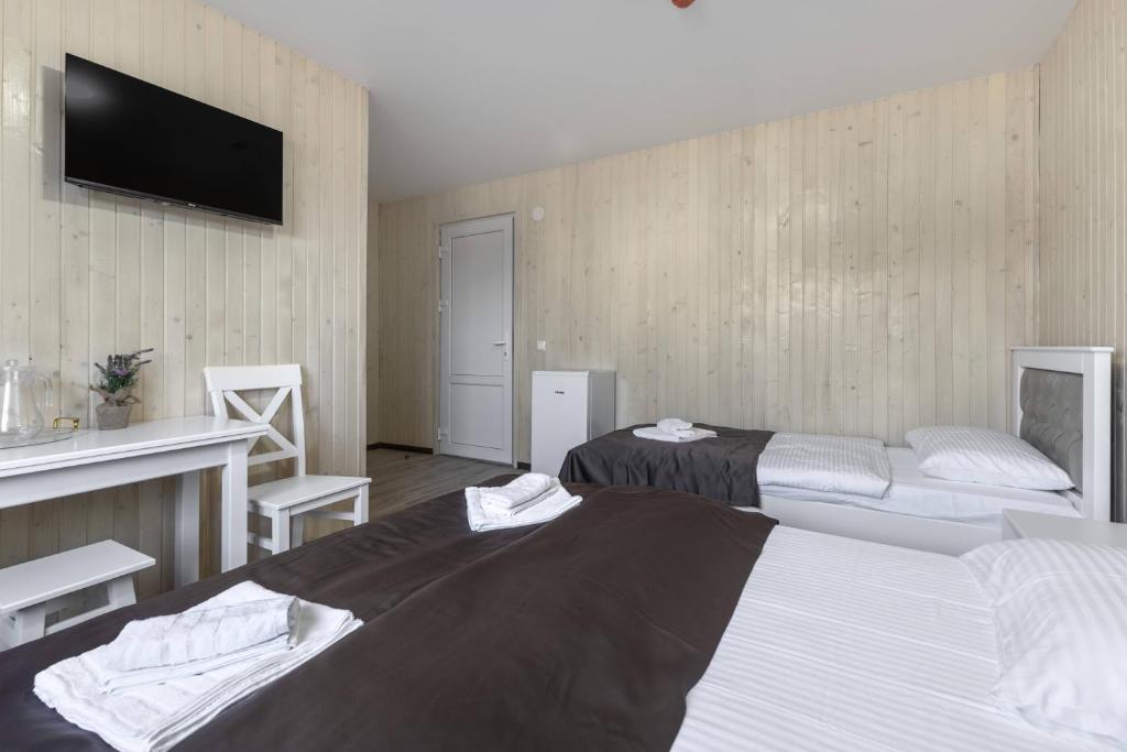Postel nebo postele na pokoji v ubytování VASOK Hotel NEW 2025