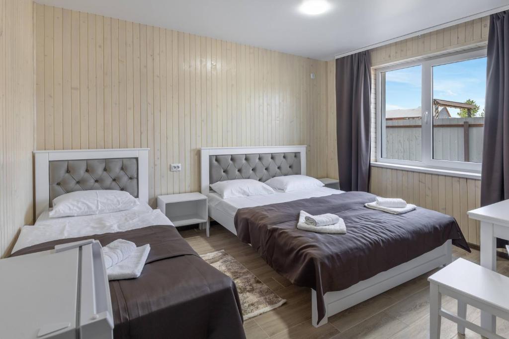 Postel nebo postele na pokoji v ubytování VASOK Hotel NEW 2025